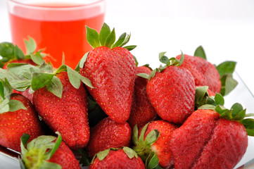 strawberries and red glass of juice