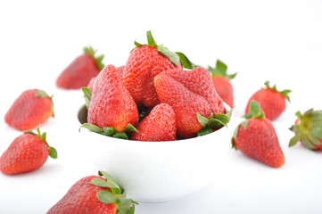 strawberries in bowl and one with bite