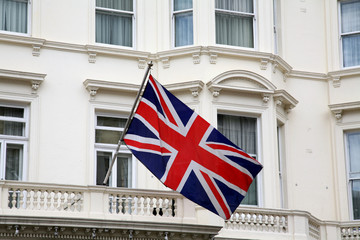 Fototapeta na wymiar British flag flying from building