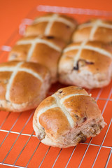 Hot cross buns on a baking tray