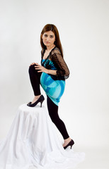 Lovely woman with her leg up on a stool