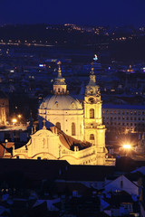 Fototapeta na wymiar Night Prague with St. Nicholas' Cathedral