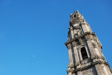 tower and moon in the blue sky