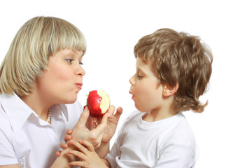 woman and boy eating apple