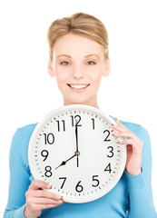 woman holding big clock