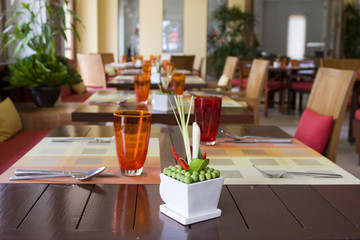 Table and chairs in empty cafe.Thailand.
