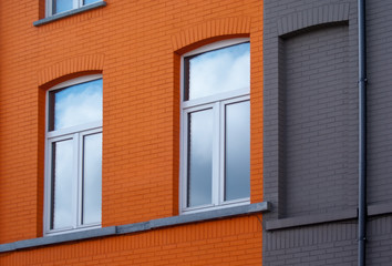 Windows on orange wall