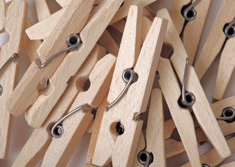 Heap of wooden clothes-peg. Top view. Abstract backround.