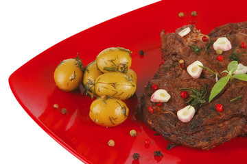 roast beef slices on red dish