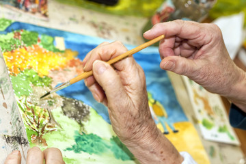 seniors in a dorm painting with color