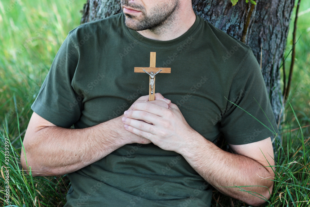 Wall mural Man with cross