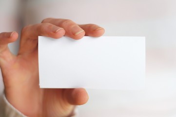 Obraz premium hand and blank paper with copyspace