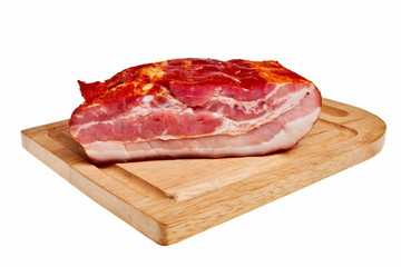Smoked bacon on wooden board isolated over white background.