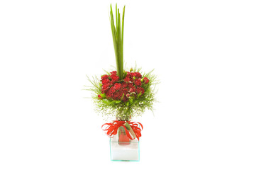 red roses colorful flower arrangement in classy glass vase bow