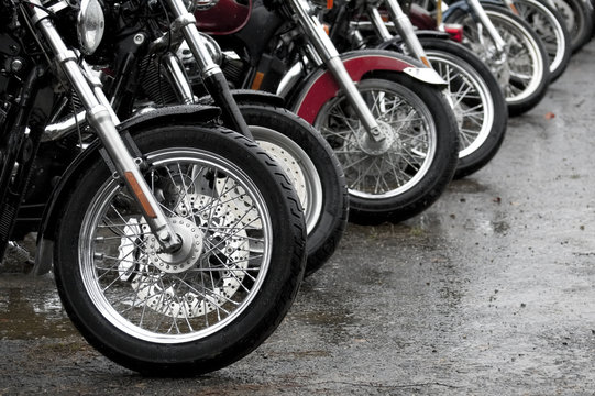 gathering of motorcycles on a rainy day