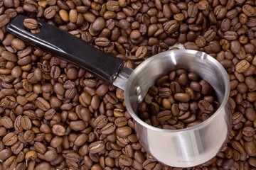 silver coffee pot and beans