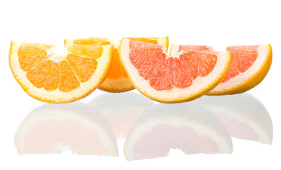 orange and grapefruit peaces with reflection