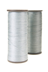 large spools of thread on a white background