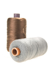 large spools of thread on a white background