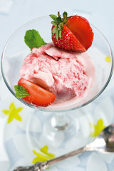 Ice-cream with a fresh strawberry