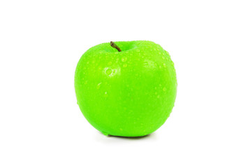 Wet green apple with water spray