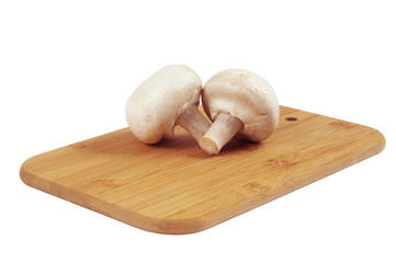 Mushrooms on a wooden board.