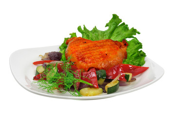 Fried chicken on a plate with vegetables