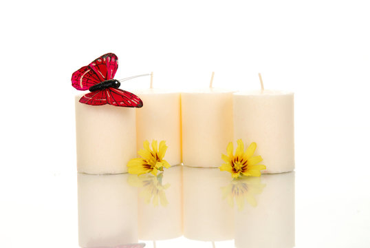 Red buttrfly atop a candle