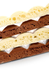 Stack of brown and white porous chocolate