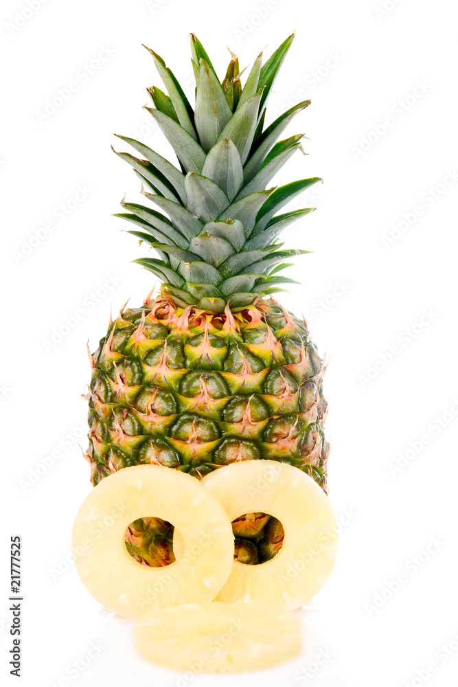 Wall mural Ripe pineapple with slices isolated