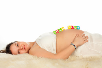 Pregnant Smiling Woman Lying