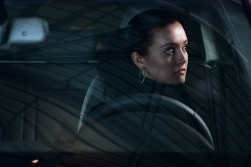 young pretty woman driving car