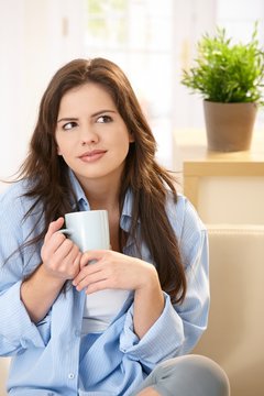 Young woman drinking morning coffee