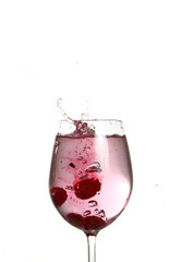 Fruit falling in a glass