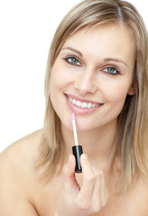 Charming woman putting gloss