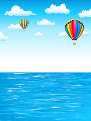 Fototapeta na wymiar Heißluftballons über dem Meer