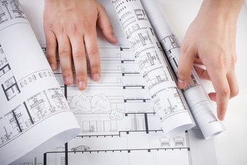 Architectural plans and blueprints in office