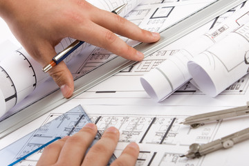 Architectural plans and blueprints in office