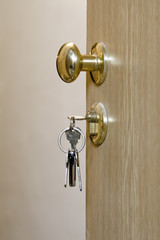 wooden door with keys