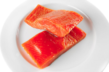 pink smoked salmon on white plate