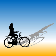 Fototapeta na wymiar woman rides a bike