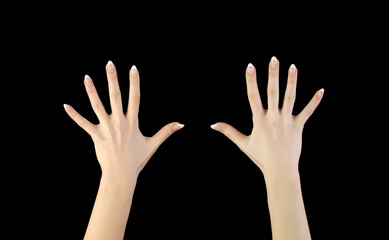 Two woman's hands in darkness