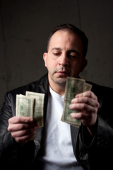 Man Counting His Money