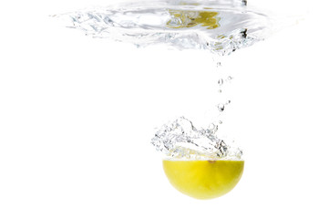 Lemon splashing in water