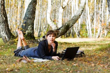 Young businesswoman working on nature.