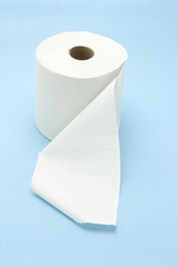 White toilet roll on seamless blue background