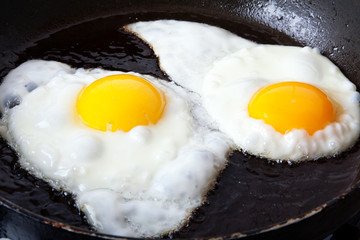 Eggs frying in oil