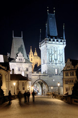 Obraz premium Night Prague with St. Nicholas' Cathedral and Bridge Tower