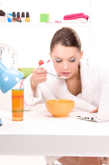 eating woman laptop computer