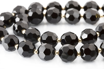 black beads on white